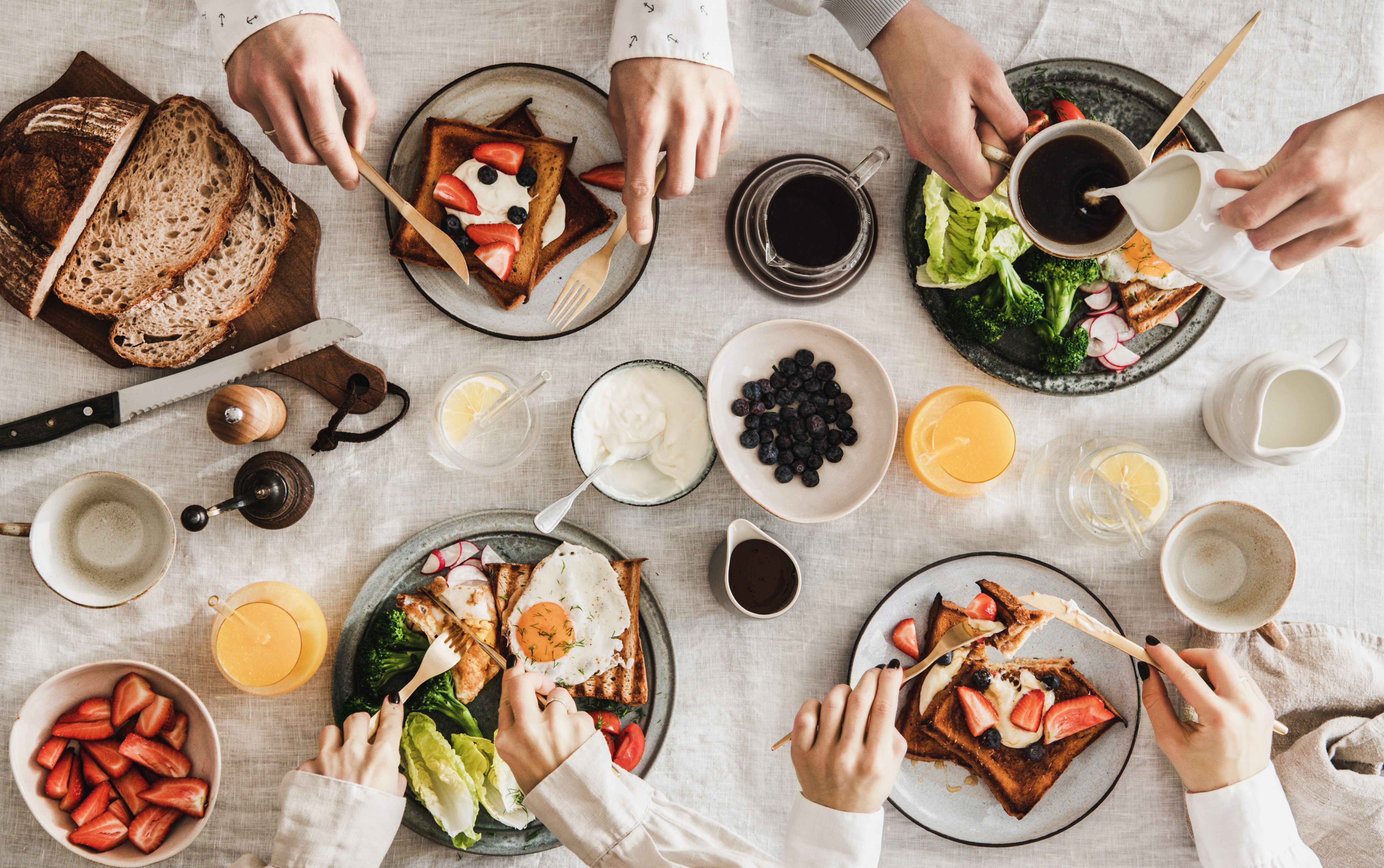 people-having-breakfast-with-coffee-and-snacks-ove-2026-01-05-05-17-24-utc.jpg